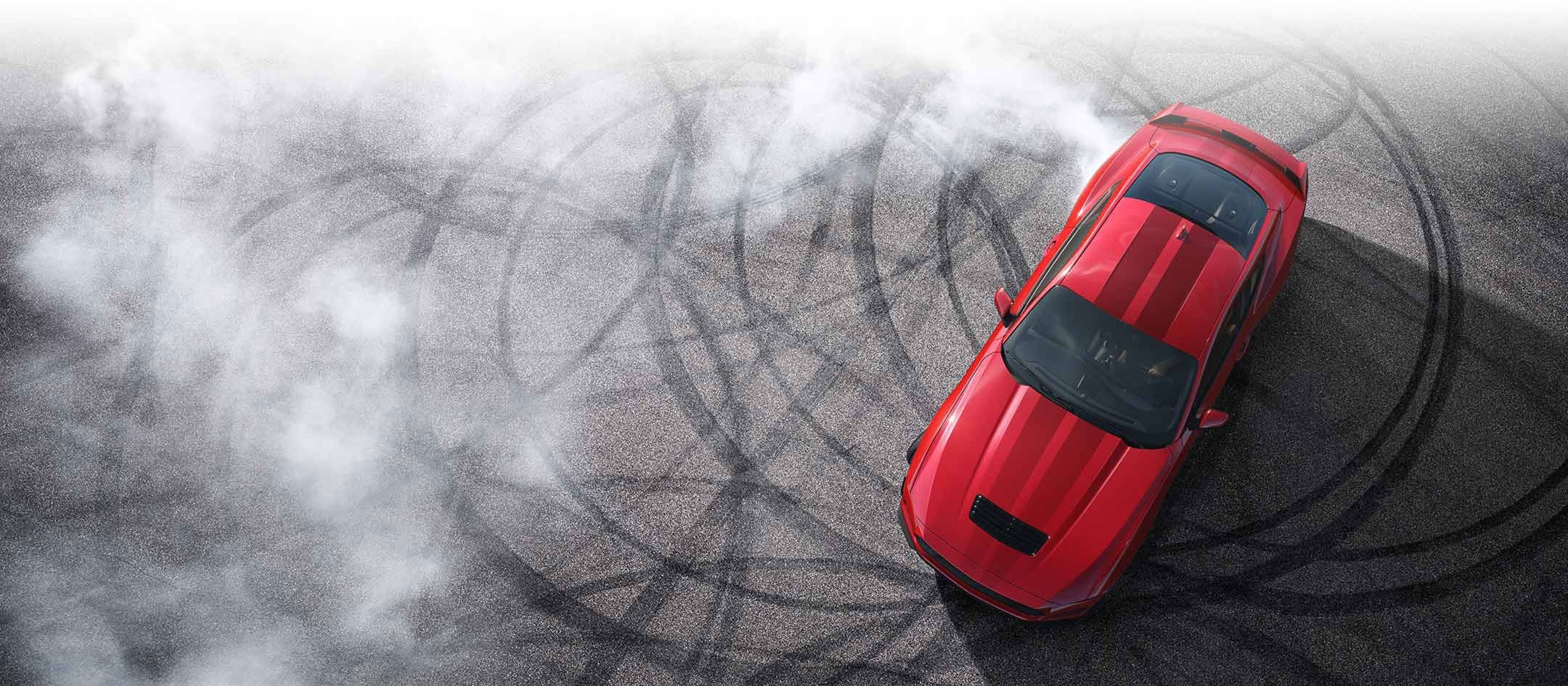 Overhead view of a 2024 Ford Mustang® model with tire tracks on pavement | Santee Ford in Manning SC