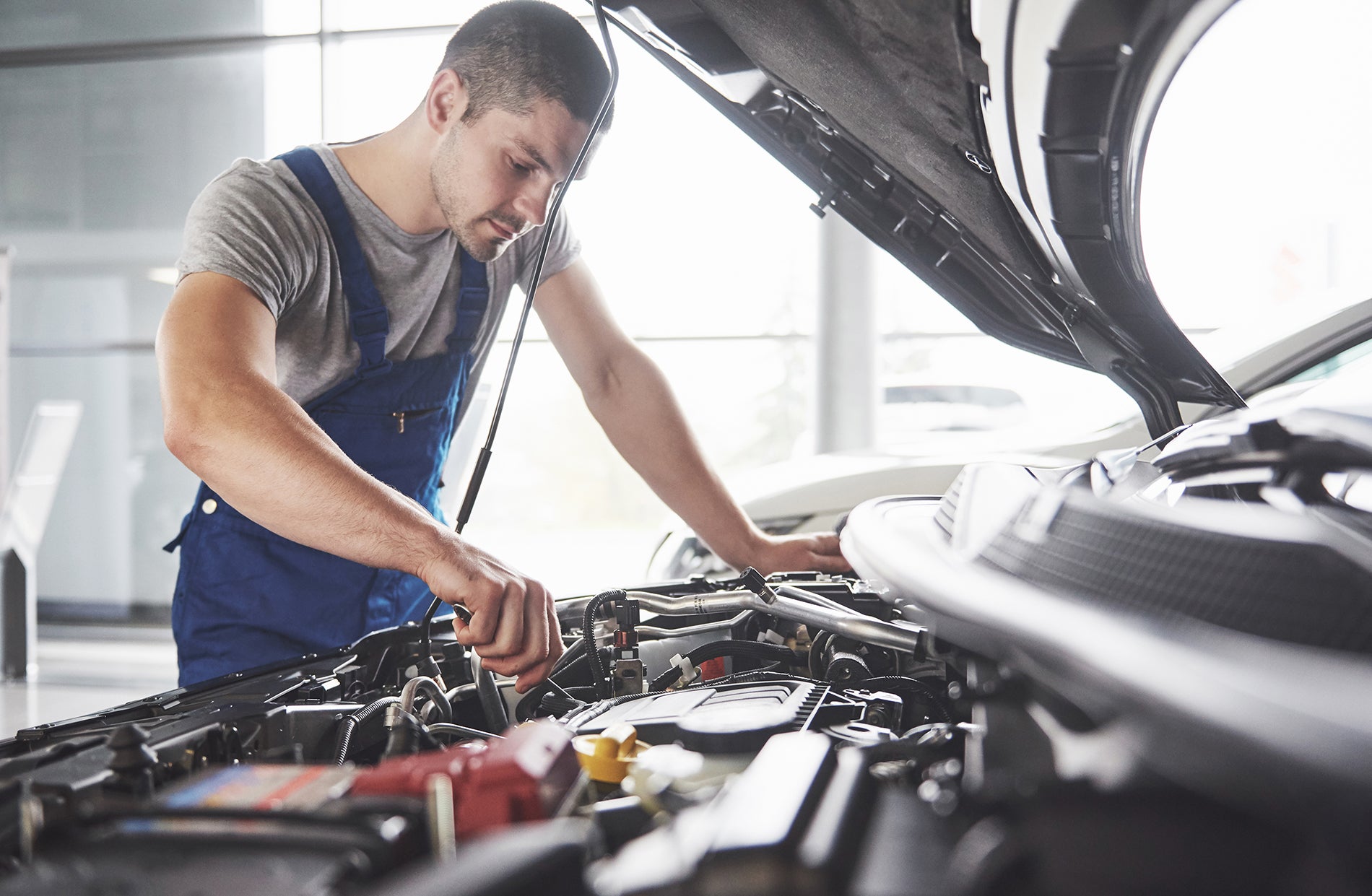 Ford certified technician performing service